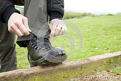 Woman tying boot laces