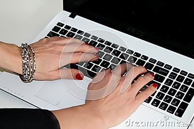 Woman typing on the laptop.