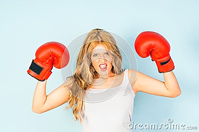 Woman in vest wearing red boxing gloves