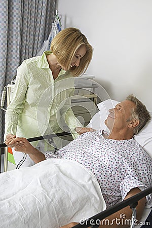 Woman Visiting Man In Hospital
