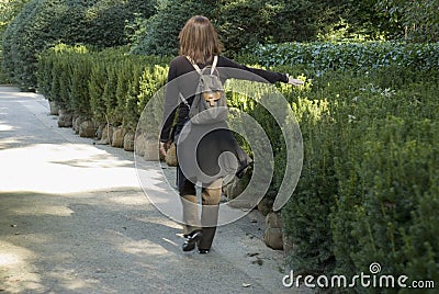 Woman walking alone on park path
