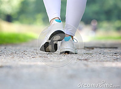 Woman walking in running shoes outdoors