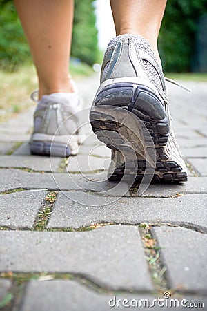 Woman walking, sport running shoes