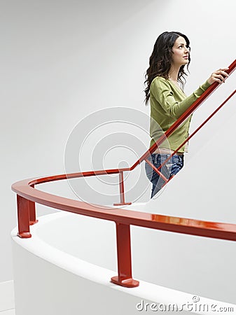 Woman Walking Up Stairs Indoors
