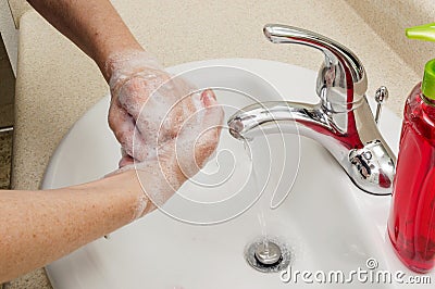 Woman Washing Hands With Liquid Soap