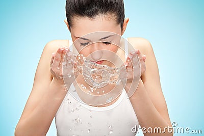 Woman washing her face