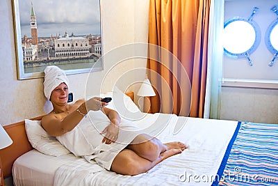 Woman watching TV on her bed