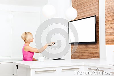 Woman watching tv hold remote control