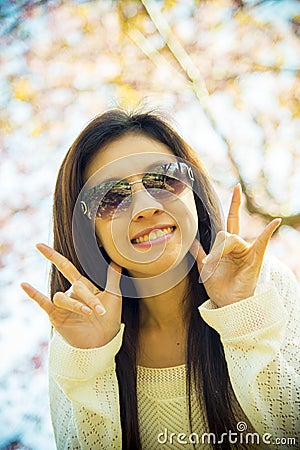 Woman wear eyeglass with pink cherry flower tree