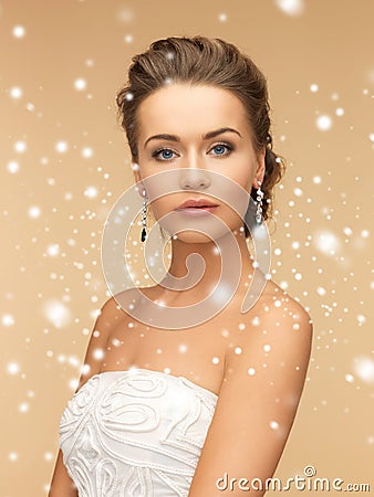 Woman wearing shiny diamond earrings