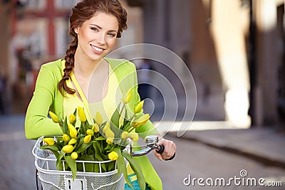 Woman wearing a spring skirt like vintage pin-up holding bicycle