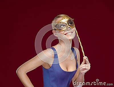 Woman wears masquerade mask