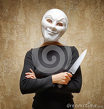 Woman in white mask holding the knife