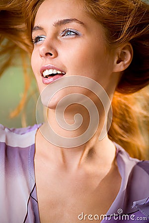 Woman with wind blowing hair