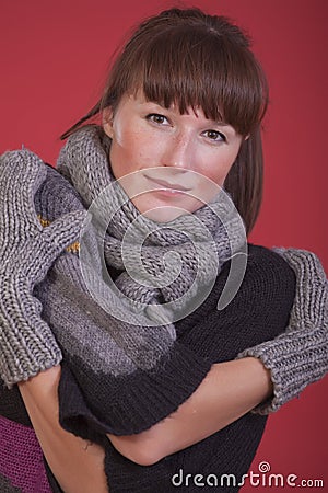 Woman in winter scarf and gloves