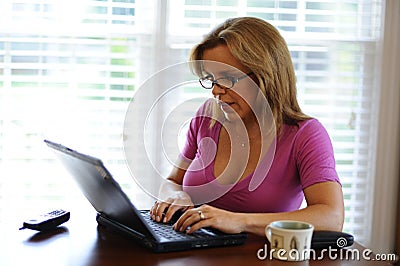 Woman working on computer at home based business