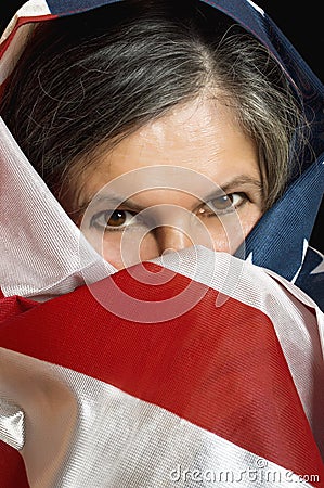 Woman wrapped in a United States flag.