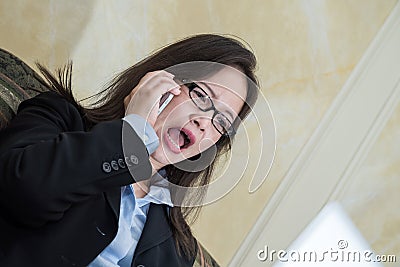 Woman yelling on a phone