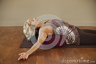 Woman On Yoga Bolster