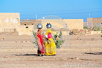 Women carrying water in Rajasthan, India