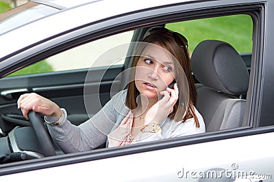 Women on a cell phone in car