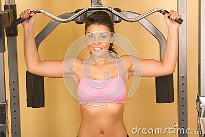 Women exercising on weightlifting machine