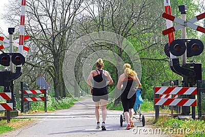 Women are jogging with baby in stroller,Holland