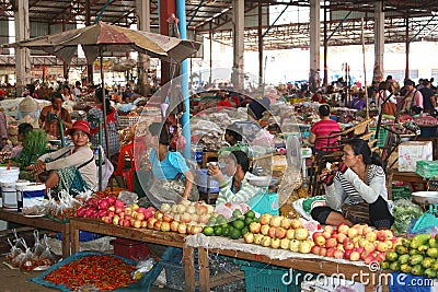 Female workers at the fruits market in Laos