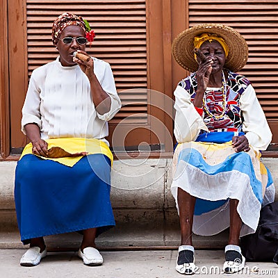 Women in Old Havana smoking cuban cigars