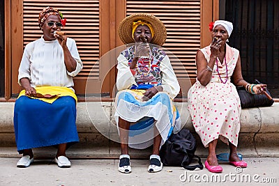 Women in Old Havana smoking cuban cigars