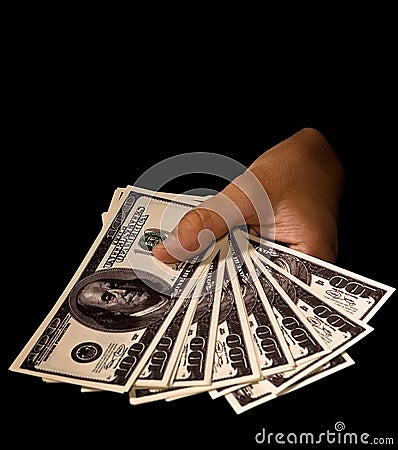 Women s hands with packs of dollars