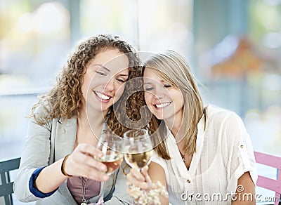 Women toasting with white wine