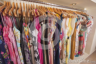 Womens clothes hanging on rail