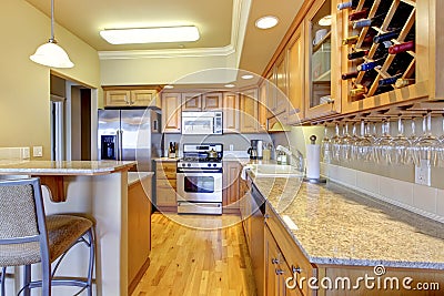 Wood golden kitchen in luxury apartment.