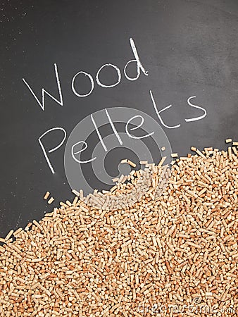 Wood pellets on a blackboard with the words wood pellets