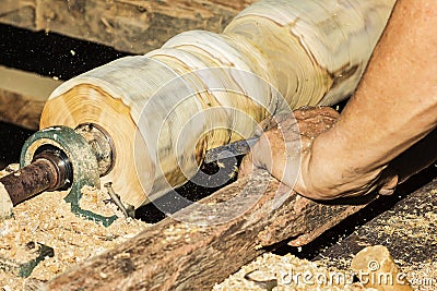Wood turning Close up of a carpenter turning wood on a lathe.