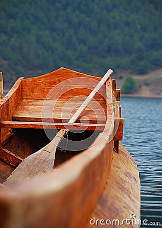 Wooden Boat floating in Lugu Lake