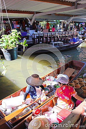 Wooden boats busy ferrying people at Talingchan fl