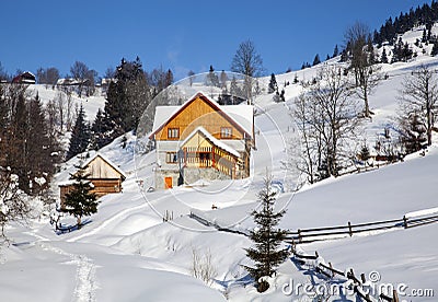 Wooden chalet in winter Carpathian mountains