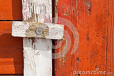 Homemade wood door latch on weathered wood.