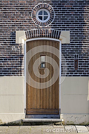 Wooden door and round window