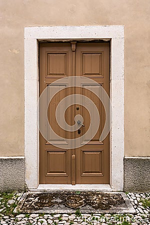 Wooden door with stone frame