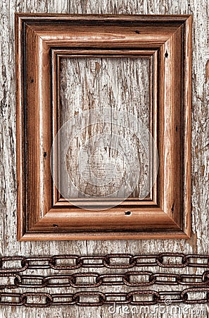 Wooden frame and metal chain on the old wood