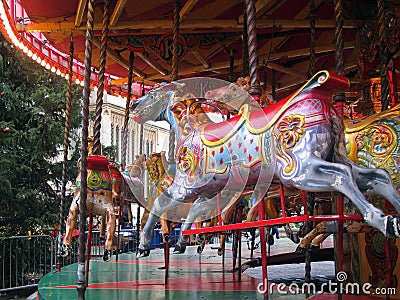 Wooden horses on a fairground ride.