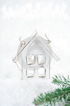 Wooden house christmas decoration on white snow background