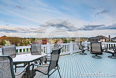 Wooden walkout deck with patio area