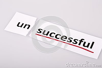 The word unsuccessful changed to successful on torn paper