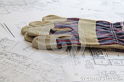 Work gloves and blueprints