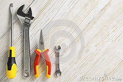 Work tools, different instrument on white wooden background