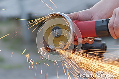 Worker cuts metal.